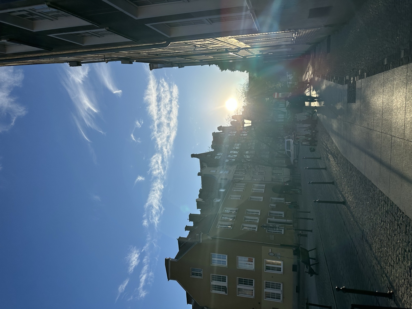 A narrow Gdańsk alley with a gothic spire at its vanishing point